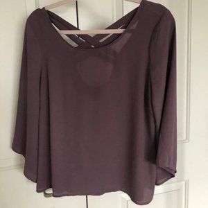 Purple 3 quarter sleeve top with criss cross back